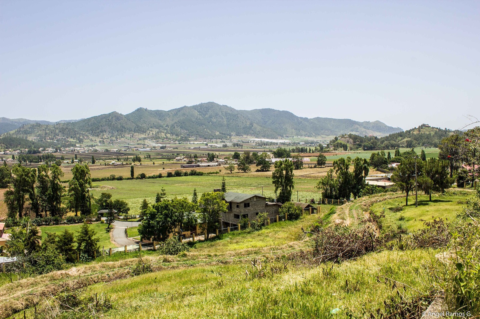 The cultivated valley of Constanza in the Cordillera Central, Dominican Republic, ringed by green mountains